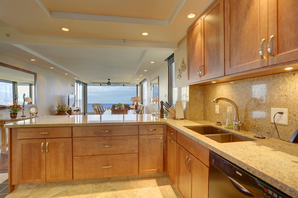 Example of a large transitional l-shaped ceramic tile and beige floor open concept kitchen design in Hawaii with a double-bowl sink, shaker cabinets, light wood cabinets, beige backsplash, black appliances, no island, quartz countertops and stone slab backsplash