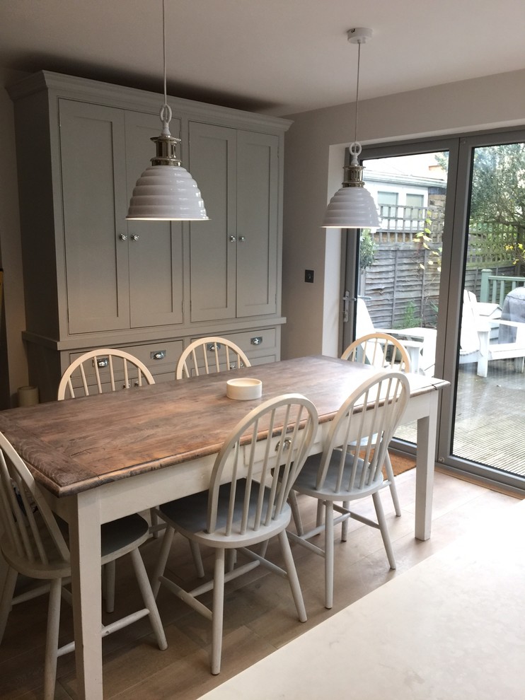 Photo of a medium sized traditional single-wall kitchen/diner in Surrey with a built-in sink, beaded cabinets, grey cabinets, quartz worktops, an island and white worktops.