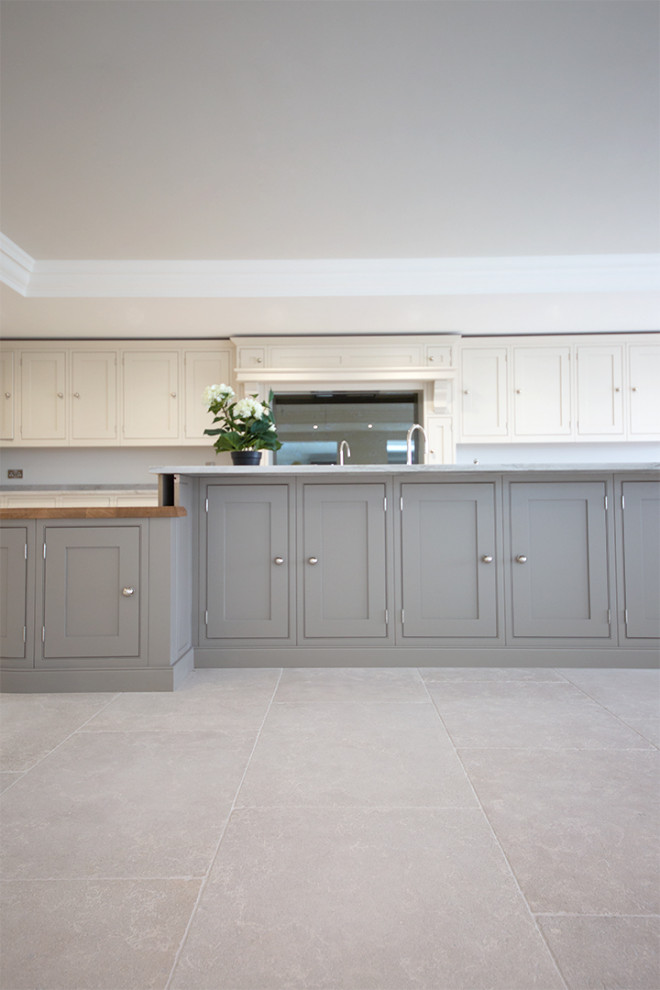 Photo of a large farmhouse grey and cream kitchen in Other with limestone flooring and grey floors.