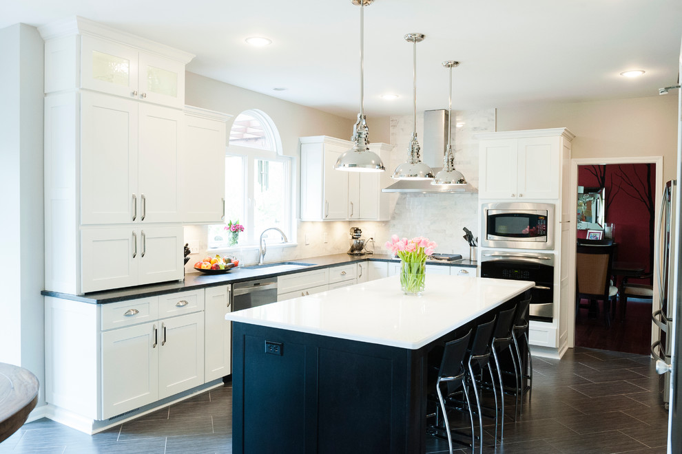 Timeless kitchen with white perimeter cabinets and a contrasting island