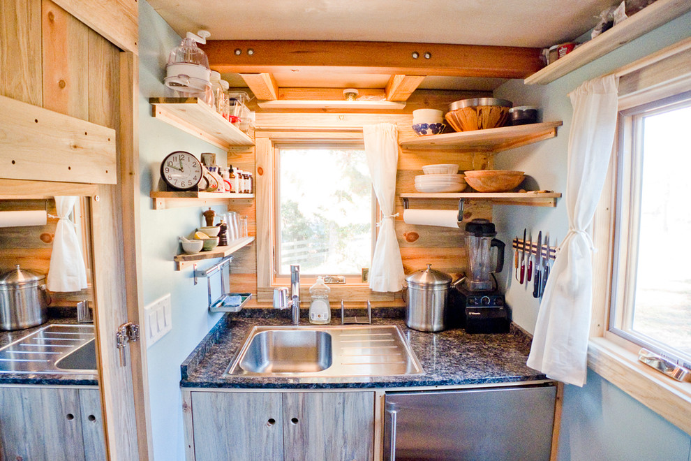 Trendy kitchen photo in San Francisco with a drop-in sink, flat-panel cabinets and stainless steel appliances