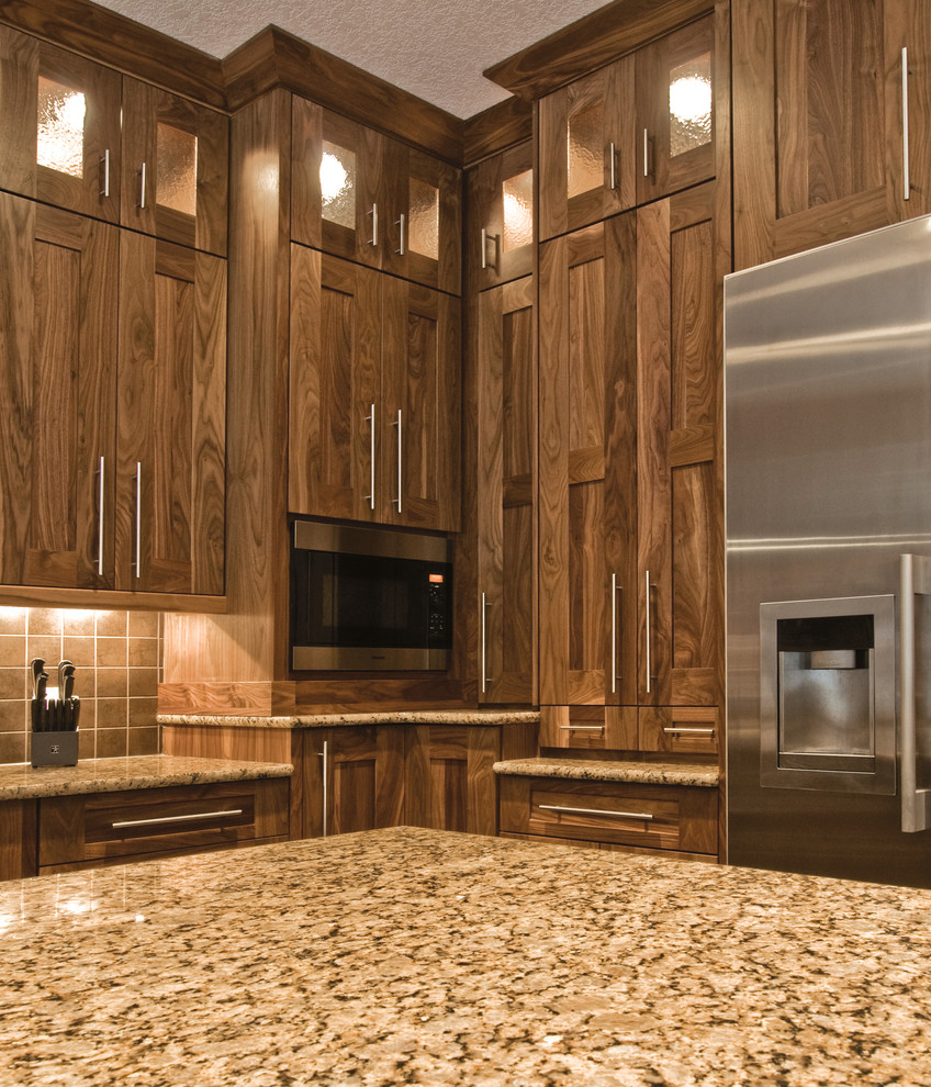 Kitchen - craftsman kitchen idea in Other with shaker cabinets, dark wood cabinets and stainless steel appliances