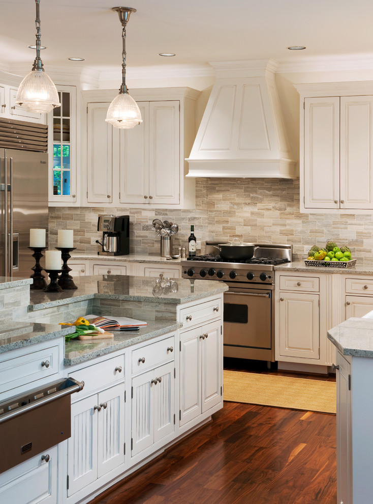 Inspiration for a transitional kitchen remodel in DC Metro with stainless steel appliances, beaded inset cabinets, white cabinets, granite countertops, gray backsplash and travertine backsplash