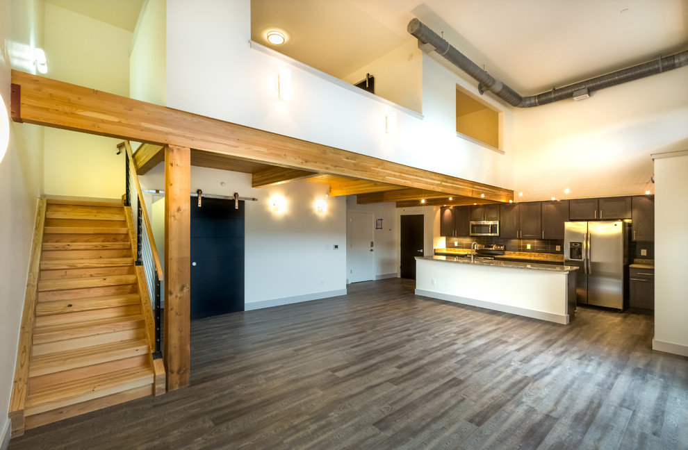 Foto di una grande cucina design con pavimento in legno massello medio, lavello a doppia vasca, top in quarzite e elettrodomestici in acciaio inossidabile