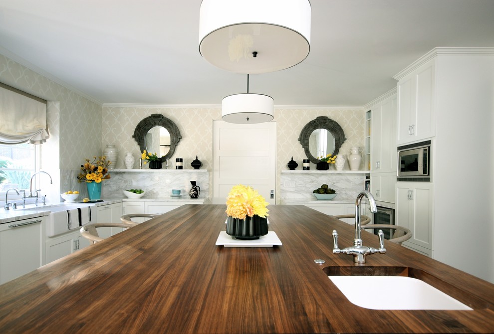 Photo of a contemporary kitchen in Los Angeles with a belfast sink and wood worktops.