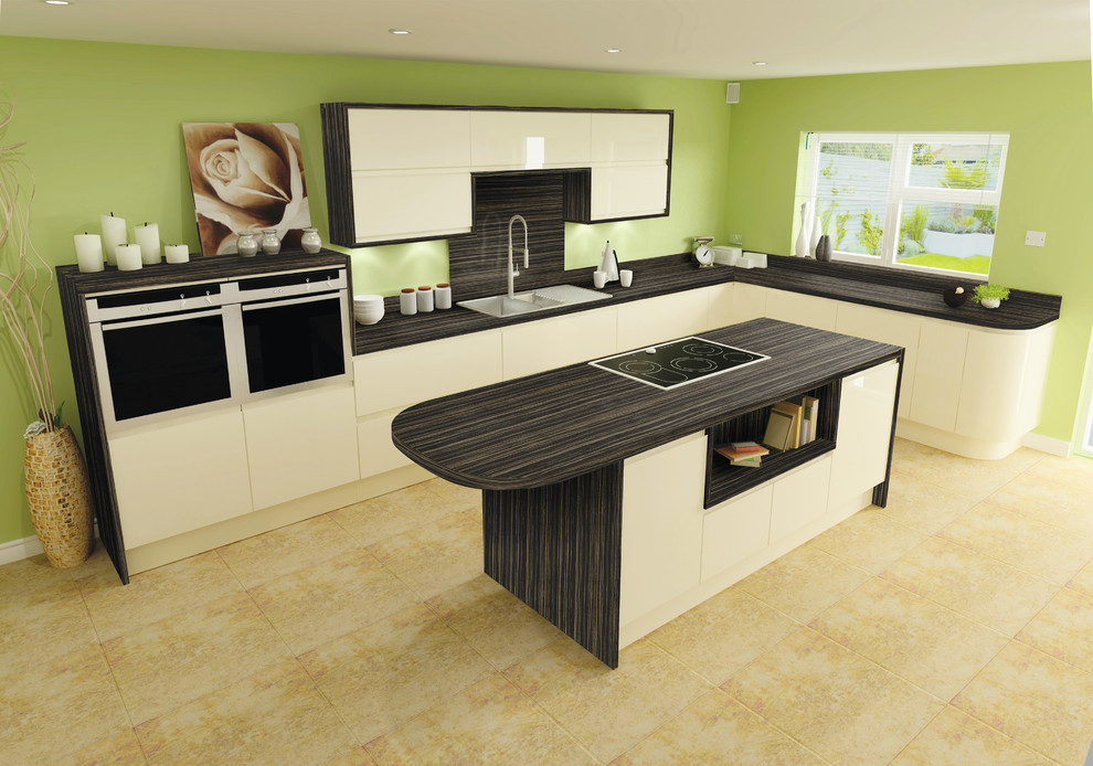 Design ideas for a contemporary l-shaped kitchen in West Midlands with laminate countertops and an island.