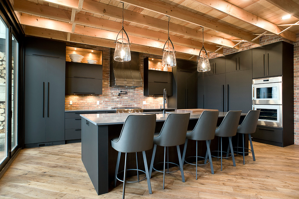 Eat-in kitchen - huge contemporary l-shaped light wood floor eat-in kitchen idea in Other with an undermount sink, flat-panel cabinets, gray cabinets, quartz countertops, multicolored backsplash, brick backsplash, stainless steel appliances, an island and gray countertops