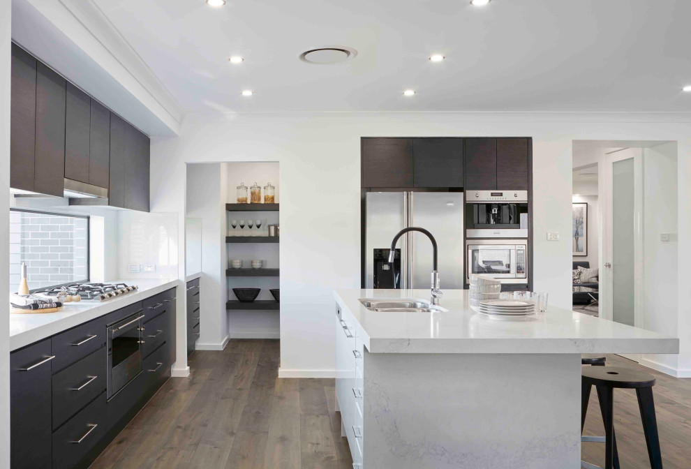This is an example of a contemporary single-wall open plan kitchen in Sydney with an island.