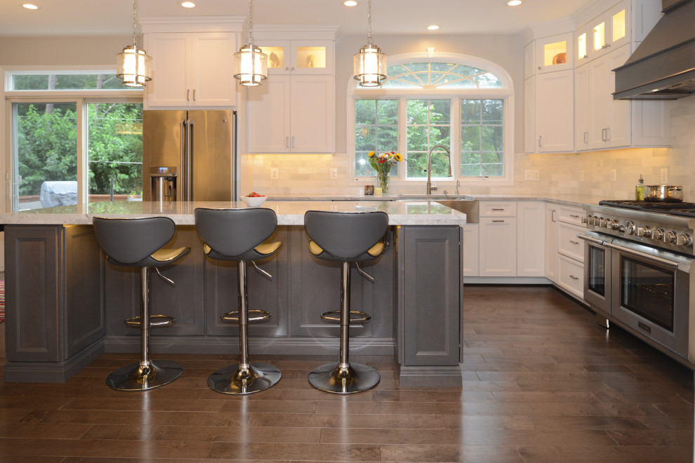 Example of a mid-sized trendy brown floor eat-in kitchen design in DC Metro with beaded inset cabinets, white cabinets, granite countertops, white backsplash, stainless steel appliances, an island and white countertops