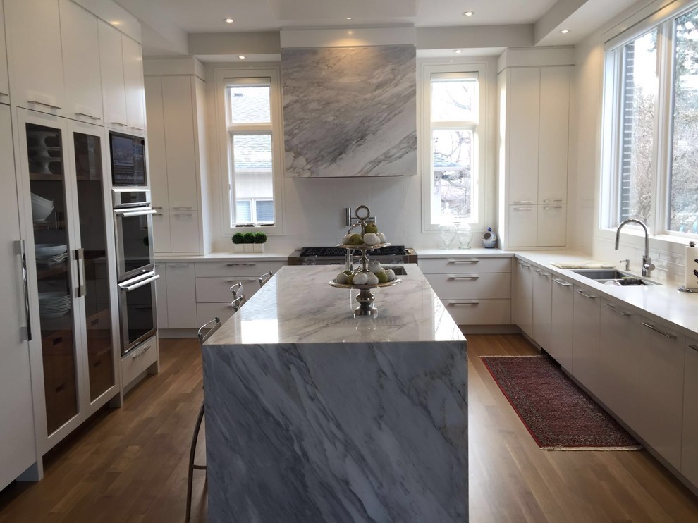 Eat-in kitchen - large modern l-shaped medium tone wood floor eat-in kitchen idea in Toronto with an undermount sink, open cabinets, brown cabinets, marble countertops, stainless steel appliances and an island