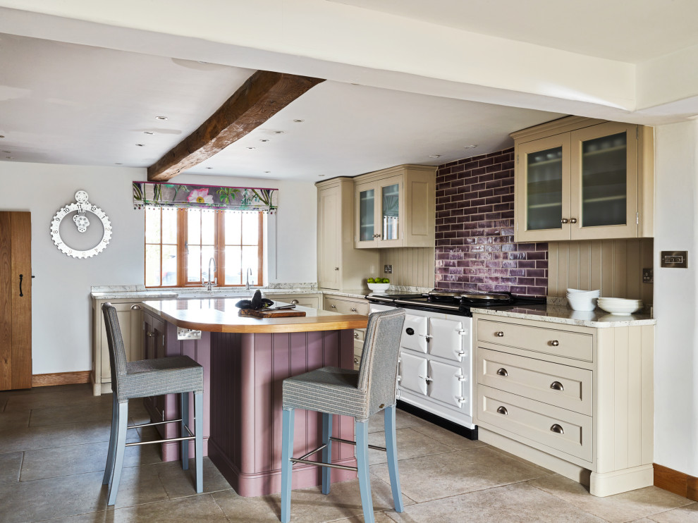 Inspiration for a farmhouse u-shaped enclosed kitchen in Cheshire with a belfast sink, shaker cabinets, beige cabinets, wood worktops, beige splashback, white appliances, an island, beige floors, brown worktops and exposed beams.