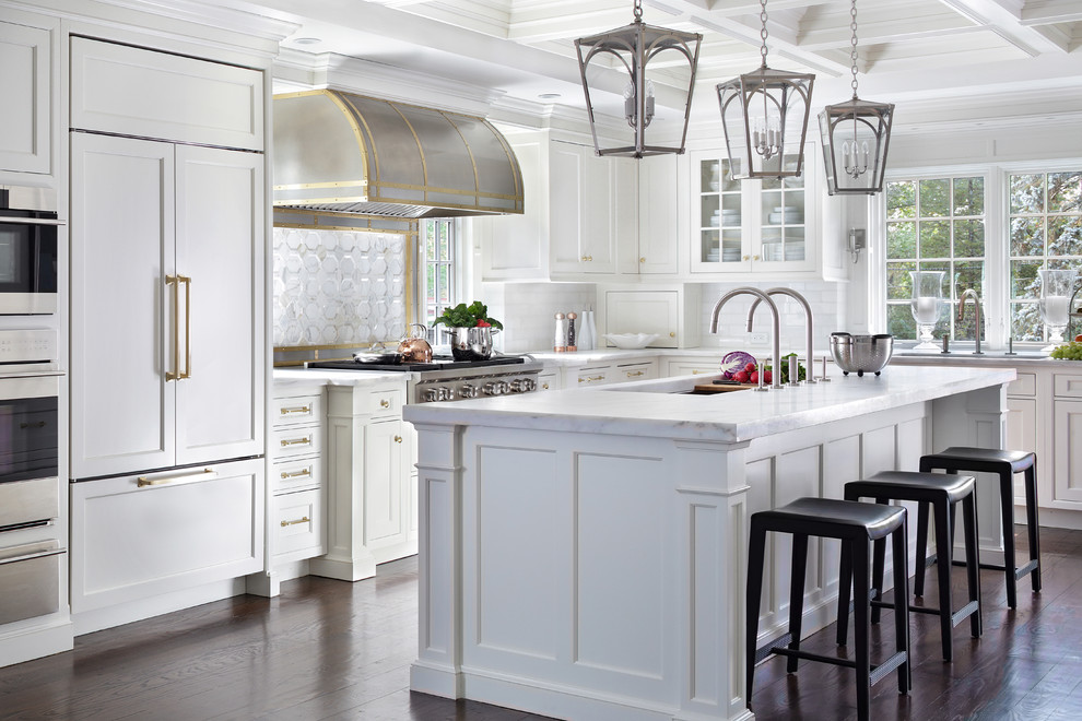 Large elegant l-shaped medium tone wood floor eat-in kitchen photo in New York with an undermount sink, beaded inset cabinets, white cabinets, marble countertops, white backsplash, stone tile backsplash, paneled appliances and an island