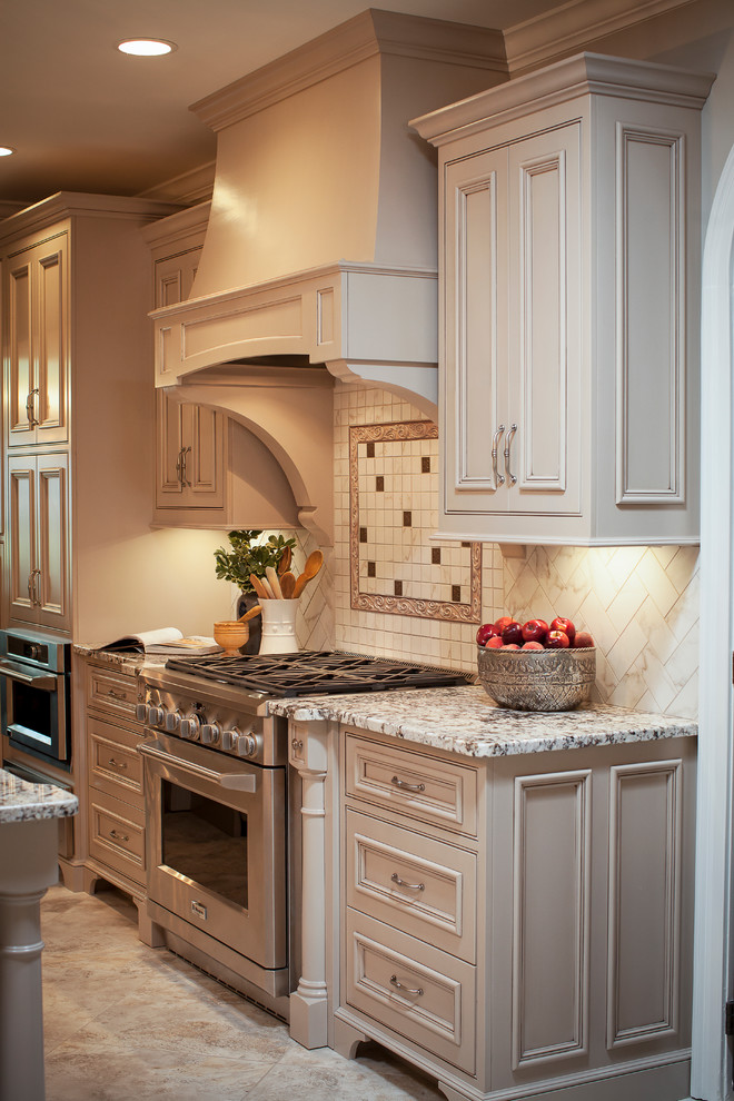 Example of a mid-sized classic galley eat-in kitchen design in Atlanta with an undermount sink, shaker cabinets, beige cabinets, granite countertops, multicolored backsplash, subway tile backsplash and stainless steel appliances