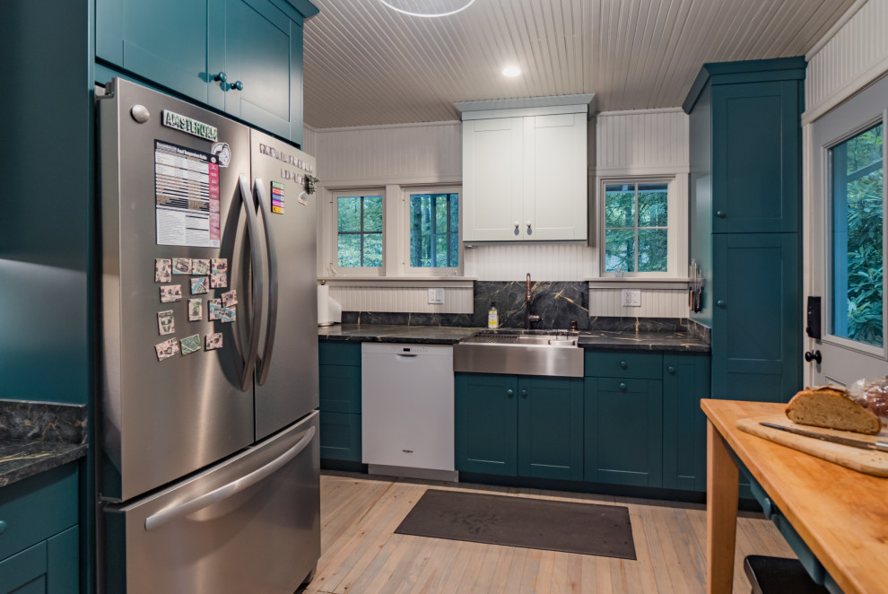 Small cottage galley light wood floor, beige floor and wood ceiling eat-in kitchen photo in Other with an undermount sink, shaker cabinets, green cabinets, soapstone countertops, black backsplash, no island and black countertops