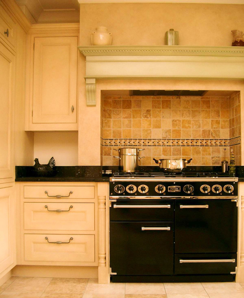 Inspiration for a medium sized classic u-shaped enclosed kitchen in Surrey with a built-in sink, shaker cabinets, distressed cabinets, quartz worktops, beige splashback, terracotta splashback, black appliances and no island.