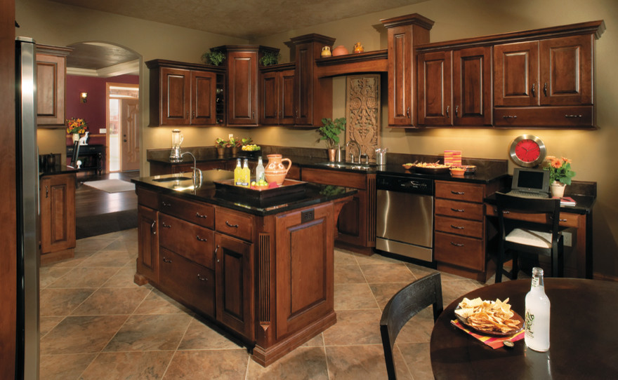 Example of a large classic u-shaped eat-in kitchen design in Other with raised-panel cabinets, dark wood cabinets, granite countertops, stainless steel appliances and an island