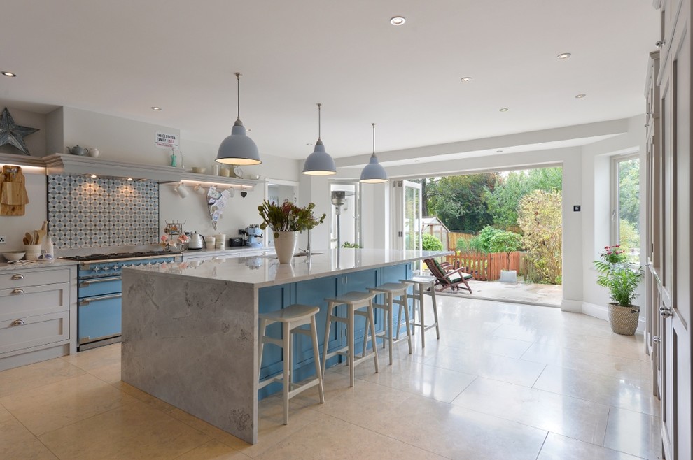 Classic kitchen in Other with shaker cabinets, grey cabinets, multi-coloured splashback, coloured appliances and an island.