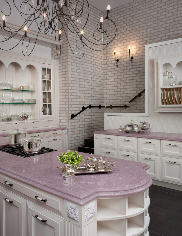 Kitchen - traditional kitchen idea in Los Angeles with recessed-panel cabinets, quartz countertops and purple countertops