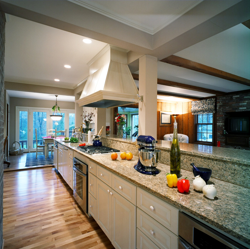 Kitchen - traditional kitchen idea in DC Metro with raised-panel cabinets, white cabinets and beige backsplash