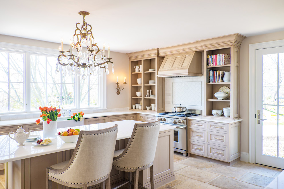 Kitchen - mid-sized traditional beige floor and limestone floor kitchen idea in Boston with a farmhouse sink, open cabinets, light wood cabinets, white backsplash, stainless steel appliances, an island, marble countertops and marble backsplash