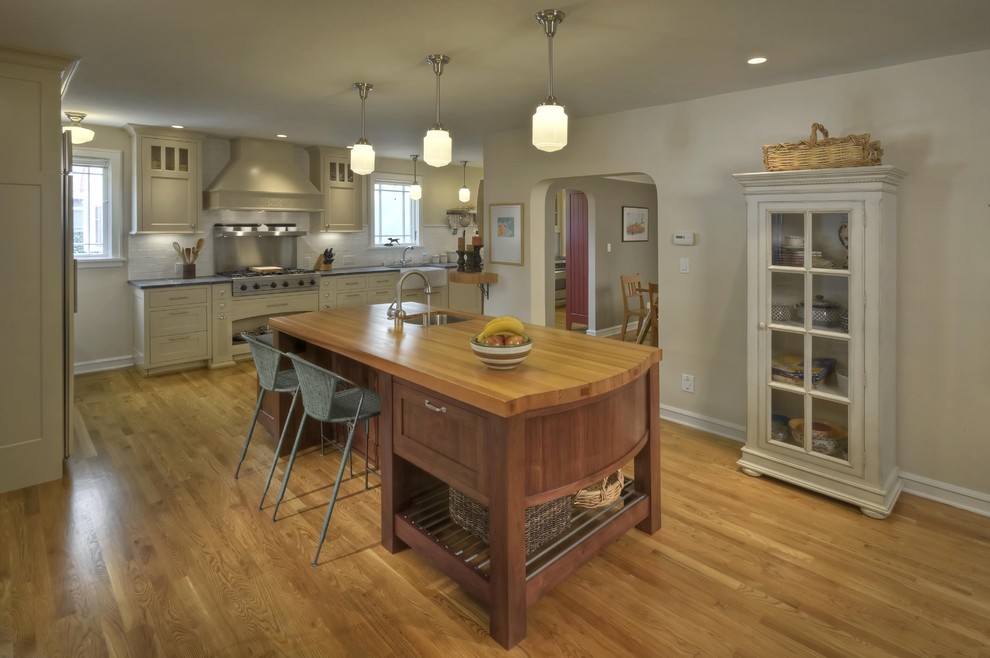 This is an example of a traditional kitchen in San Francisco with wood worktops.