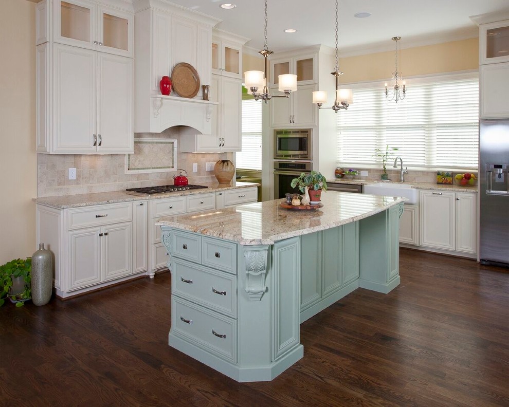 Inspiration for a large timeless l-shaped dark wood floor eat-in kitchen remodel in Raleigh with a farmhouse sink, recessed-panel cabinets, white cabinets, granite countertops, beige backsplash, stainless steel appliances and an island