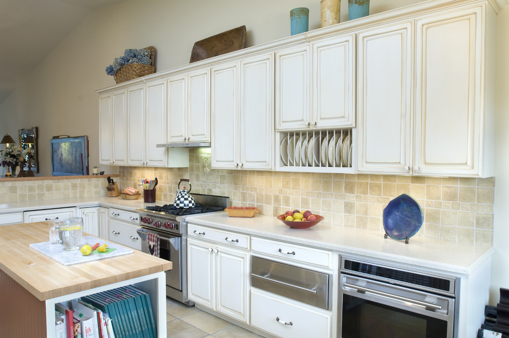 This is an example of a traditional kitchen in Other with stainless steel appliances.