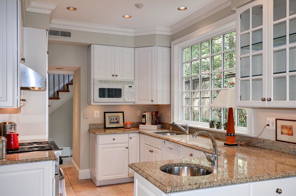 Eat-in kitchen - mid-sized traditional eat-in kitchen idea in DC Metro with white cabinets, granite countertops, stainless steel appliances, no island and multicolored countertops