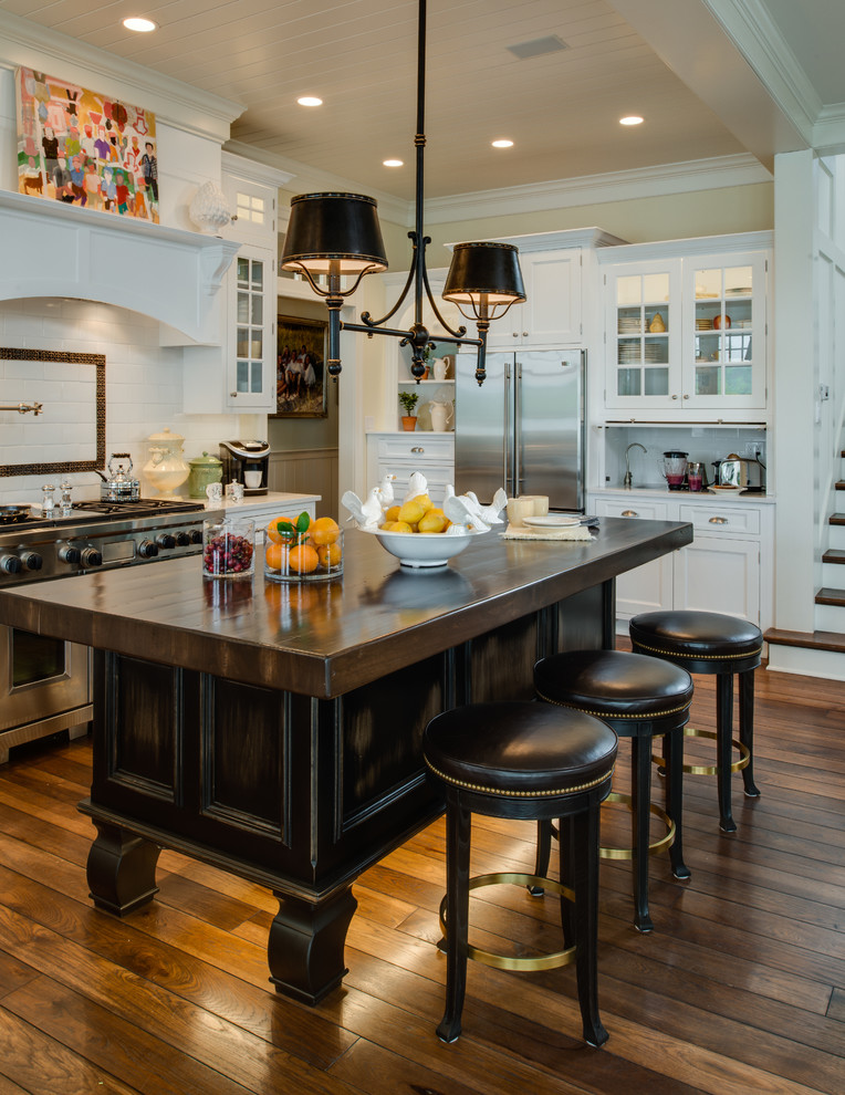 Inspiration for a timeless kitchen remodel in Detroit with recessed-panel cabinets, white cabinets, white backsplash and subway tile backsplash