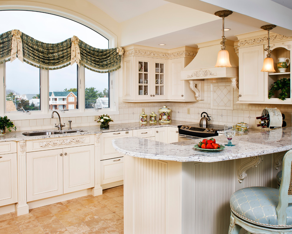 Eat-in kitchen - traditional u-shaped eat-in kitchen idea in New York with an undermount sink, granite countertops, ceramic backsplash, stainless steel appliances, recessed-panel cabinets and white cabinets