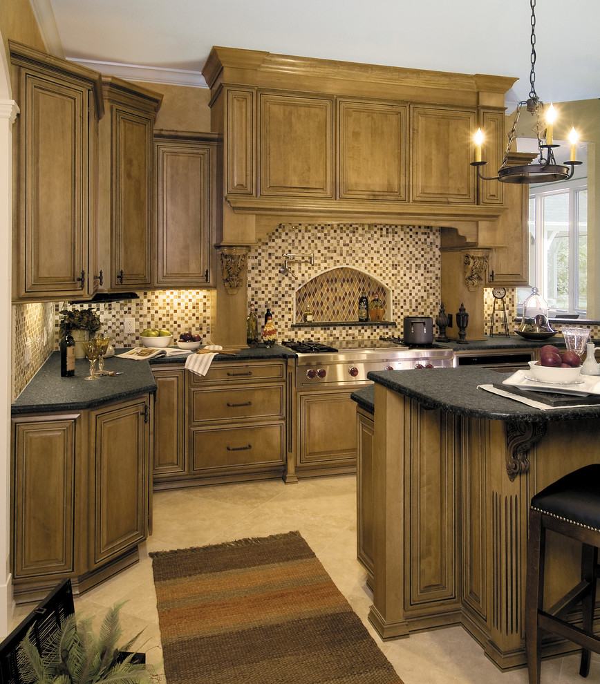 Eat-in kitchen - large traditional u-shaped eat-in kitchen idea in Other with medium tone wood cabinets, raised-panel cabinets, paneled appliances and an island