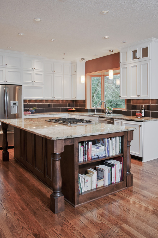 Inspiration for a timeless u-shaped open concept kitchen remodel in Other with granite countertops, an undermount sink, flat-panel cabinets, white cabinets, brown backsplash, porcelain backsplash and stainless steel appliances