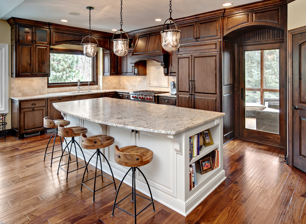Elegant l-shaped kitchen photo in Minneapolis with raised-panel cabinets and dark wood cabinets