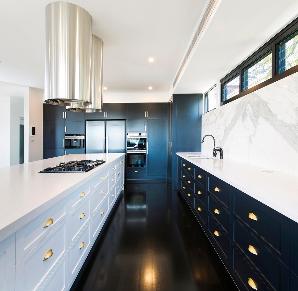 Inspiration for a large classic l-shaped kitchen/diner in Newcastle - Maitland with a submerged sink, shaker cabinets, white cabinets, composite countertops, white splashback, marble splashback, black appliances, painted wood flooring, an island, black floors and white worktops.