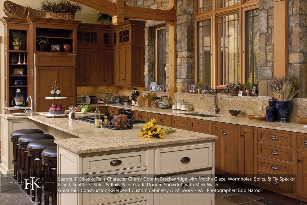 Example of a mid-sized mountain style l-shaped ceramic tile eat-in kitchen design in New York with an undermount sink, shaker cabinets, dark wood cabinets, granite countertops, stainless steel appliances and an island
