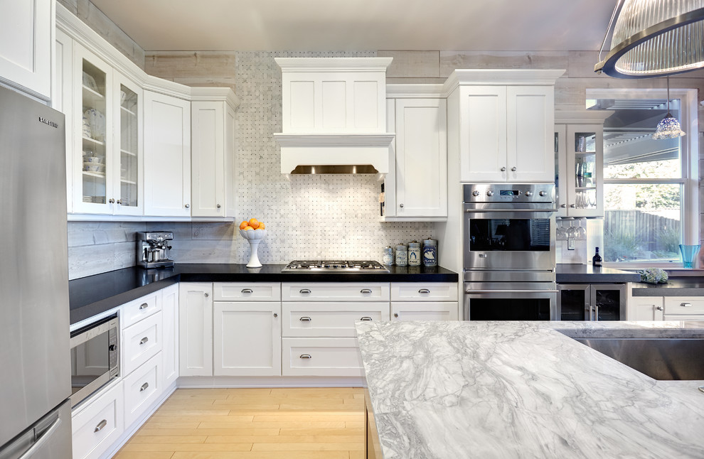 Inspiration for a timeless kitchen remodel in Other with shaker cabinets, an undermount sink, white cabinets, white backsplash, stone tile backsplash, stainless steel appliances and quartzite countertops