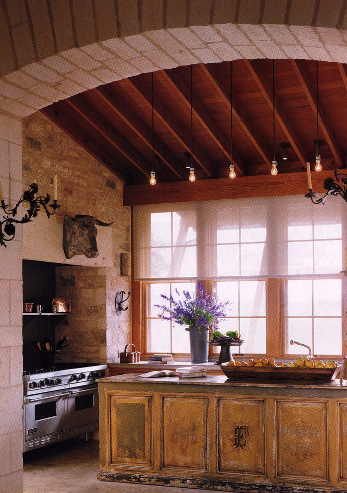 Example of a cottage kitchen design in New York with distressed cabinets