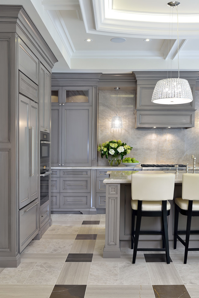 Kitchen - traditional kitchen idea in Toronto with recessed-panel cabinets, gray cabinets, gray backsplash, stone slab backsplash and an island
