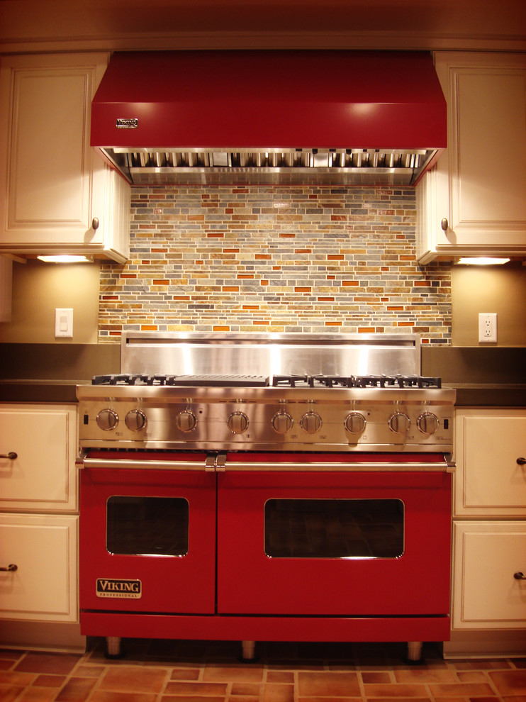 Photo of a traditional kitchen in Los Angeles with engineered stone countertops and red splashback.