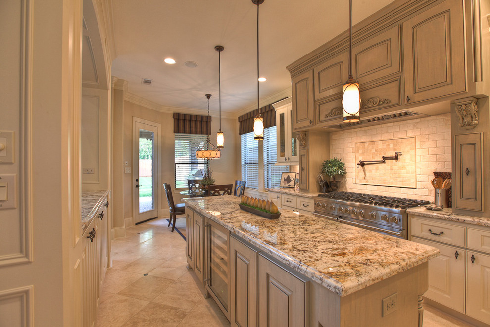 Photo of a traditional kitchen in Houston with glass-front cabinets and stainless steel appliances.
