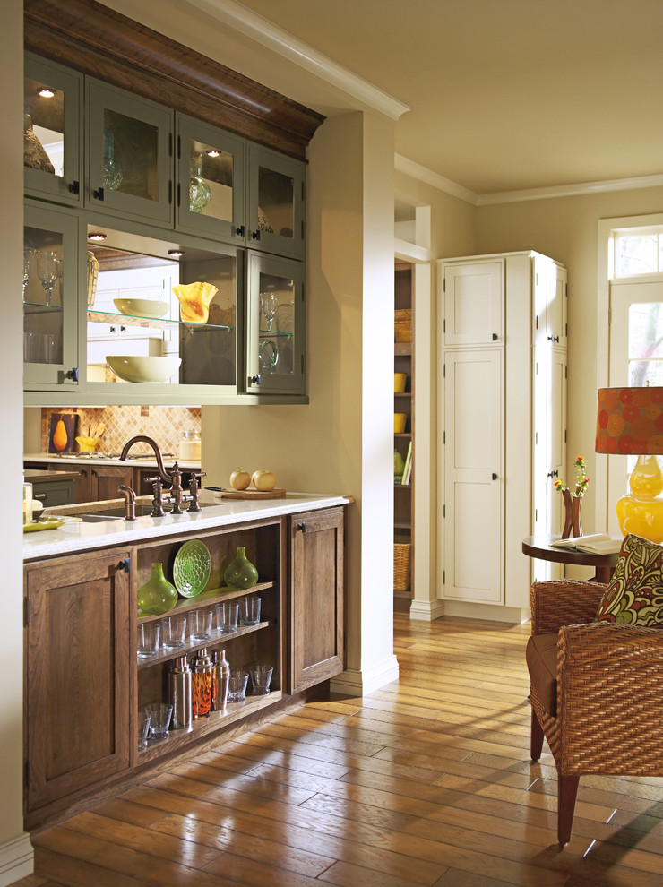 Photo of a classic kitchen in Other with glass-front cabinets.