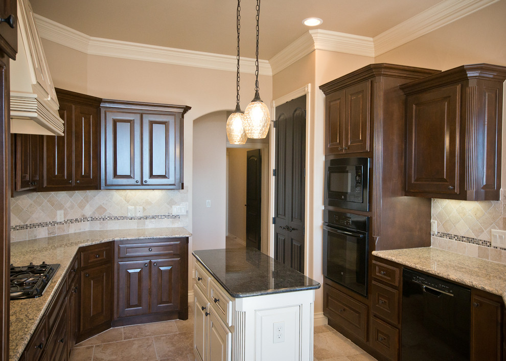 Inspiration for a mid-sized timeless u-shaped ceramic tile eat-in kitchen remodel in Oklahoma City with a double-bowl sink, raised-panel cabinets, dark wood cabinets, granite countertops, beige backsplash, ceramic backsplash, black appliances and an island