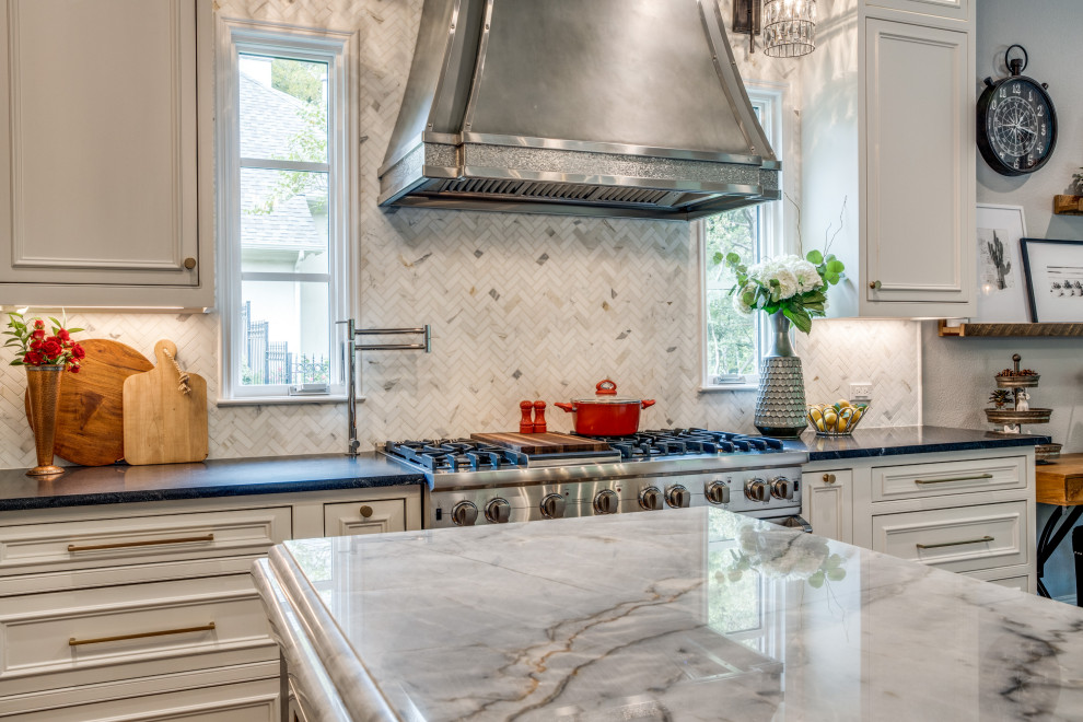 Eat-in kitchen - mid-sized traditional u-shaped medium tone wood floor eat-in kitchen idea in Dallas with a farmhouse sink, beaded inset cabinets, white cabinets, quartzite countertops, white backsplash, marble backsplash, stainless steel appliances, an island and blue countertops