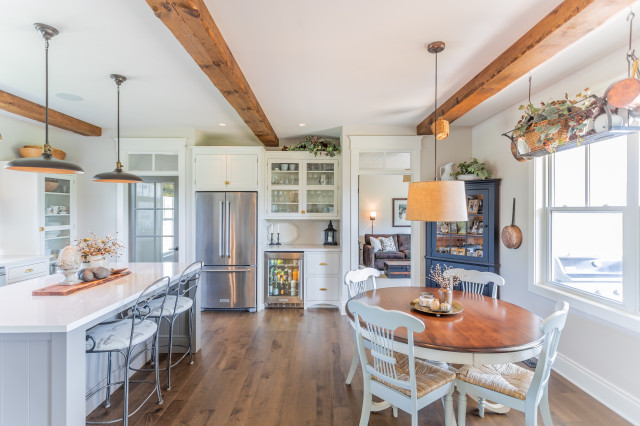 White Farmhouse Kitchen Warmed by Wood and Metal