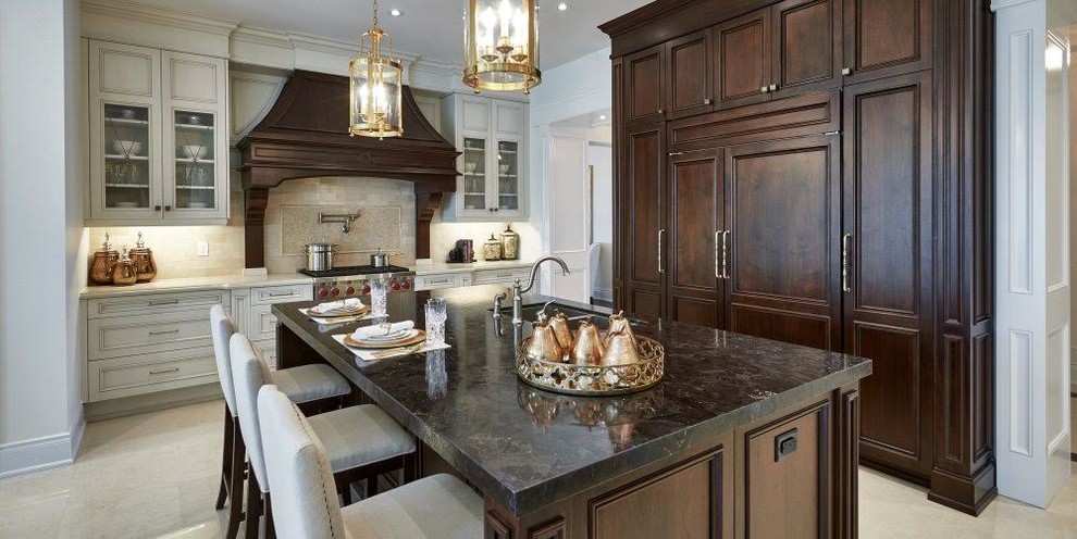 Kitchen - large traditional l-shaped ceramic tile and beige floor kitchen idea in Miami with an undermount sink, recessed-panel cabinets, dark wood cabinets, quartzite countertops, beige backsplash, stone tile backsplash, paneled appliances and an island