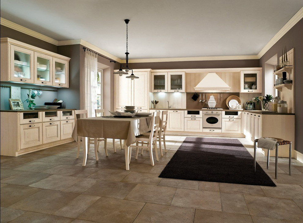Inspiration for a large timeless u-shaped beige floor eat-in kitchen remodel in Miami with a drop-in sink, recessed-panel cabinets, light wood cabinets, beige backsplash, stainless steel appliances and beige countertops