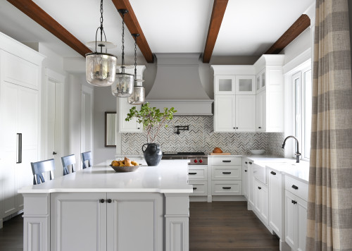 Timeless Elegance: White and Light Gray Kitchen Cabinets with Gray Chevron Tile Backsplash