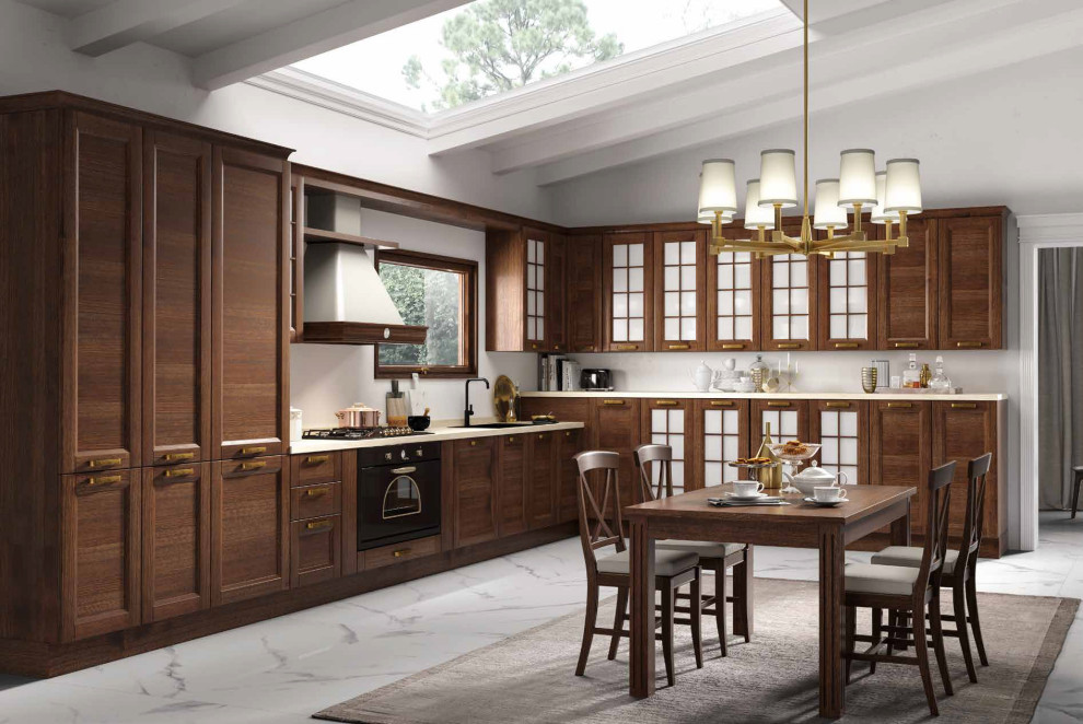 This is an example of a large classic l-shaped kitchen/diner in Miami with recessed-panel cabinets, medium wood cabinets, black appliances, marble flooring, white floors and beige worktops.