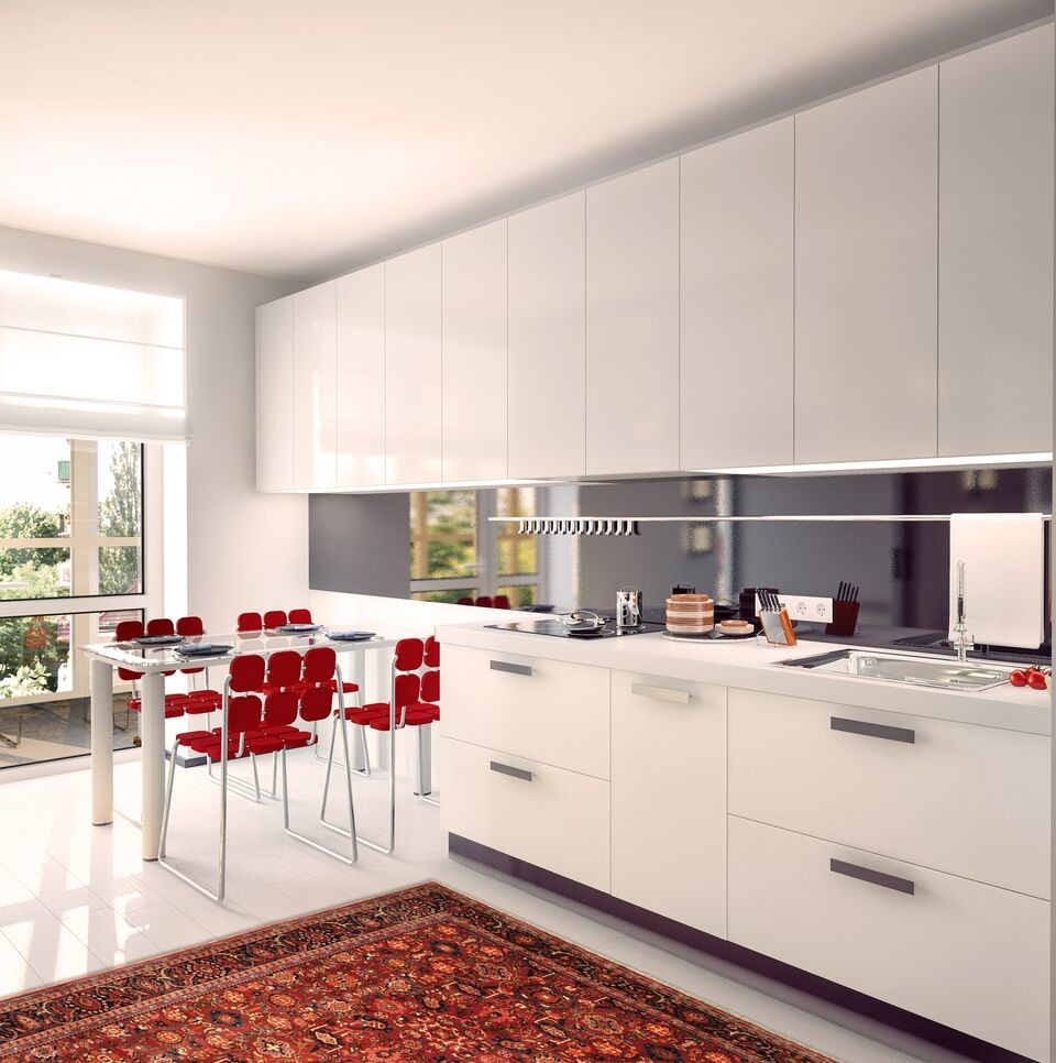 Eat-in kitchen - large modern galley porcelain tile and white floor eat-in kitchen idea in Phoenix with a drop-in sink, flat-panel cabinets, white cabinets, solid surface countertops, black backsplash, glass sheet backsplash, stainless steel appliances and no island