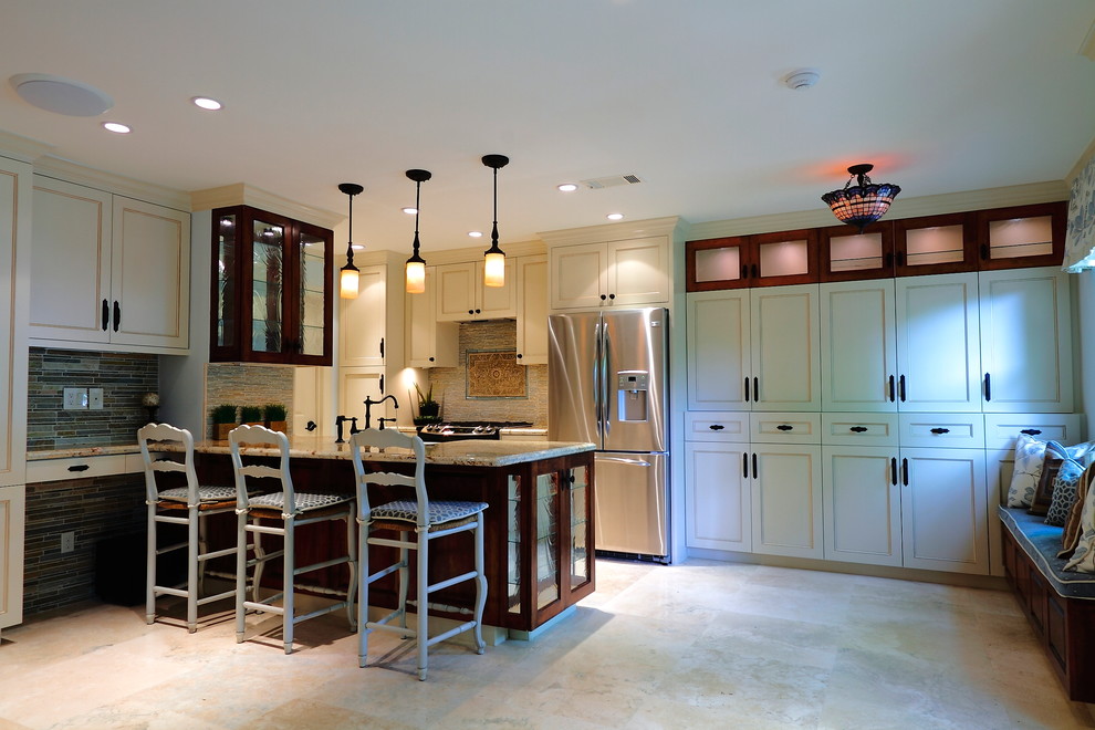Eat-in kitchen - small traditional galley limestone floor eat-in kitchen idea in Houston with a farmhouse sink, beaded inset cabinets, beige cabinets, granite countertops, gray backsplash, stainless steel appliances and an island